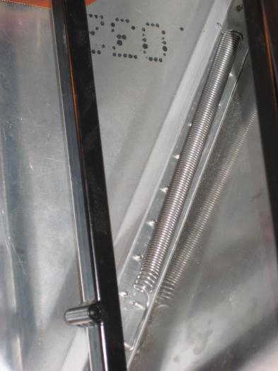 Rudder return spring in background, against diagonal longeron