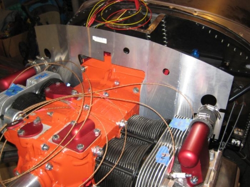 With intakes and upper spark plugs removed, beninning to fit baffle.