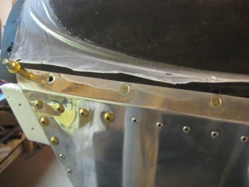 I could get this many screws in place with my long arms, but no further.