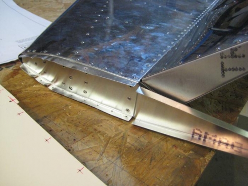 Extra rib in place at the left tip.