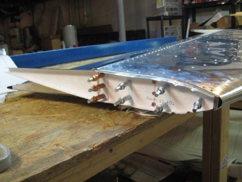 RIGHT horiz tail tip rib held temporarily with clecos.