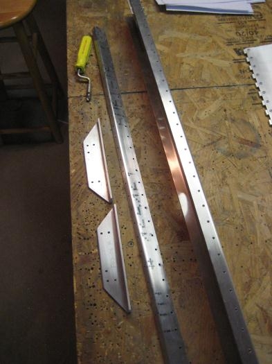 Took all the rear spar carry through parts out and deburred.