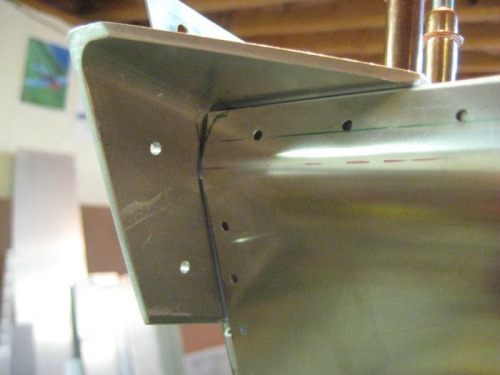 The corners of the firewall are square and do not fit in the curved bracket. Needs trimming.