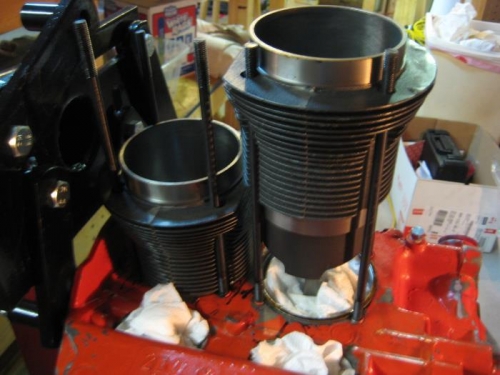 Permatex on the shim, then the cylinder slides into place.