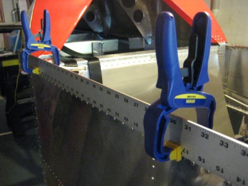 Using a long straight edge for hinge alignment