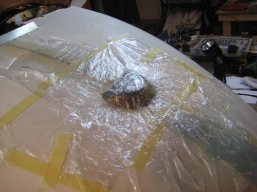 Plastic cling wrap over the clay mold.