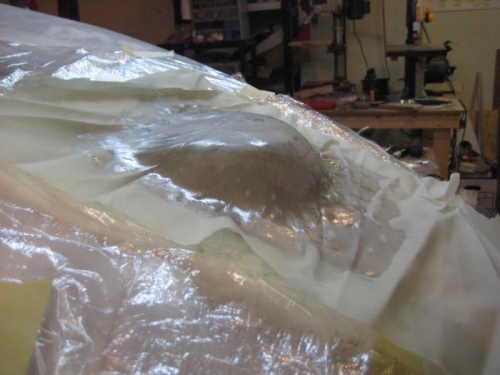 3 layers of fiberglass, with peel/ply over.