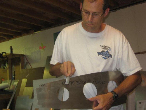 Filing and sanding....