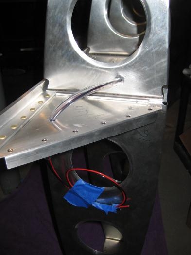 At the wing tip, the vinyl tubing with the wiring inside. Again, lots of extra wire.