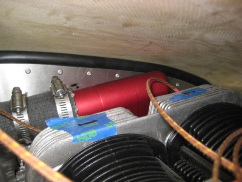 Cowl against left baffle