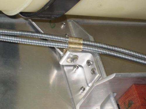 Bracket to secure throttle and mixture cables