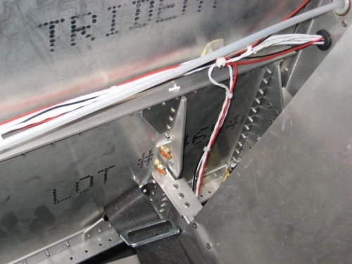 Wires passing to the right of the passenger seat. Again, zip ties and Click Bond supports.