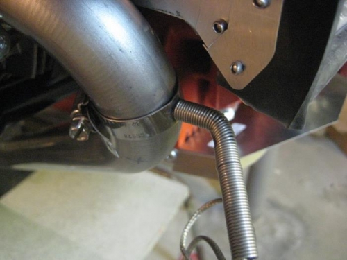 Bent over the CHT probe at the front right exhaust.