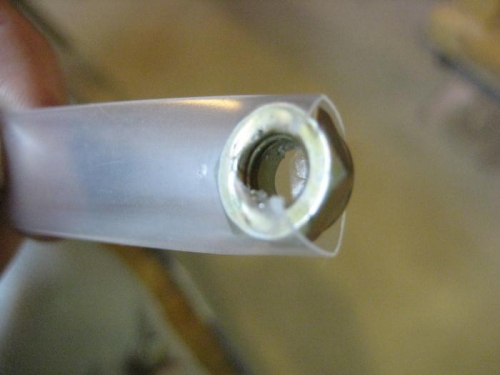 Heat shrink tubing to hold nut in awkward location.