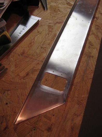 The same hole, all cleaned up, with all the pilot holes drilled as well