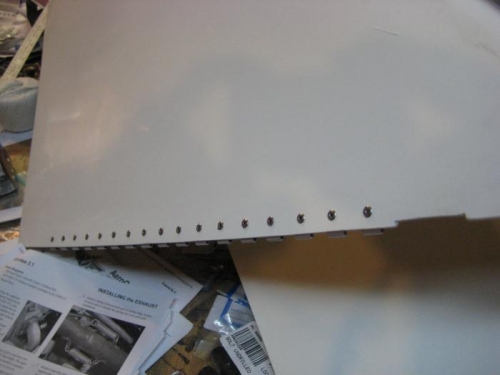 Side hing half riveted in place.