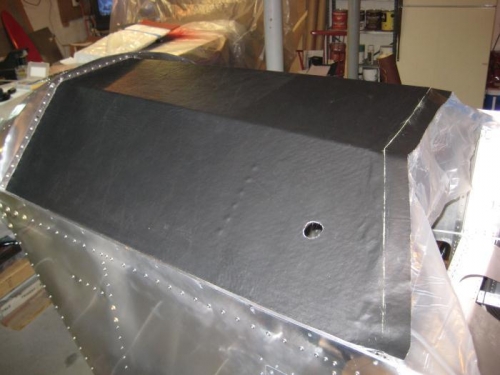 Holes cut in fabric for accessory outlet.