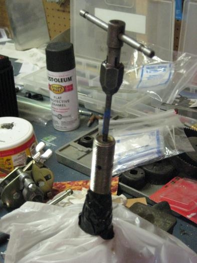 10-32 tap in the end of each axle