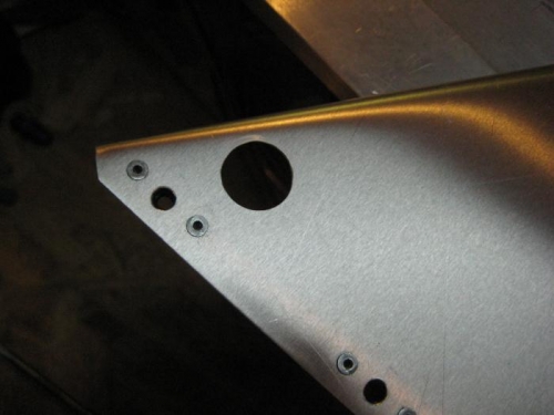 Hole in instrument panel for upper end of site guage.