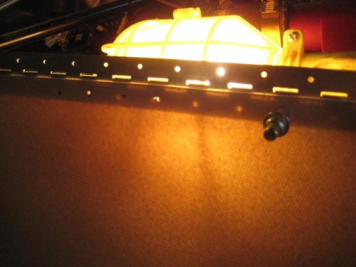 With upper cowl removed for clarity, here is the shop light shining through the hinge.