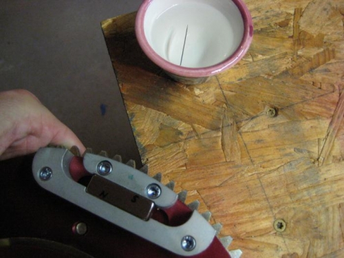 Using a needle/water compas to check the flywheel magnet