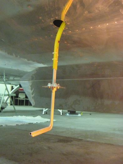 Pitot-static hanging down from wing.