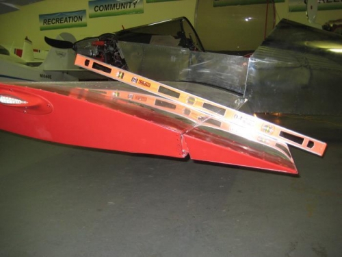 Left wing, setting the angle of the aileron.