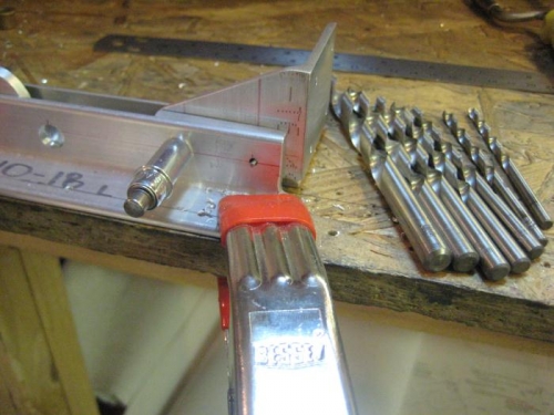 I used all those bits to make the large hole to the left, then reamed to the final diameter.