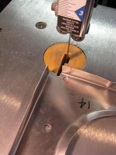 After drilling a hole at each corner, I used the band saw to cut out.