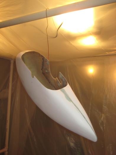 Wheel pant hung from PVC booth structure.