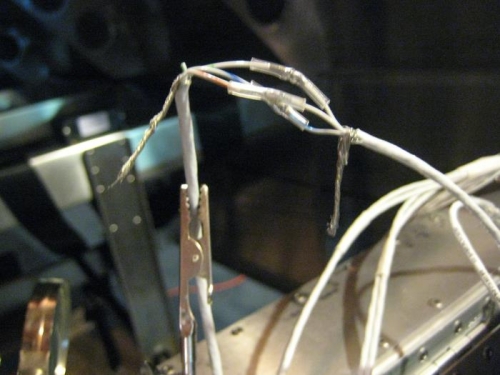 Connections in progress. Butt splices are soldered and then heat shrunk.