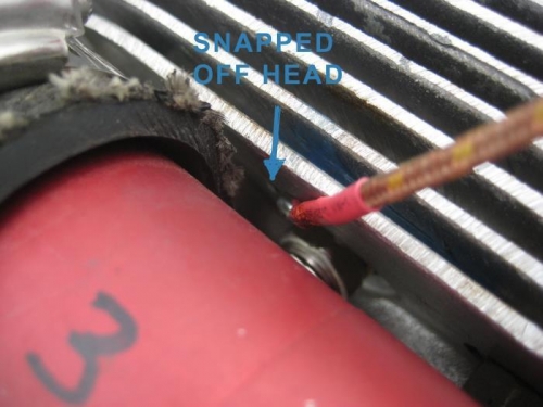 New screw in place. Can see the old screw with broken head.