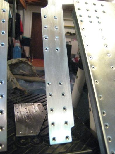 Angles with countersinks; aft tunnel web with dimples.