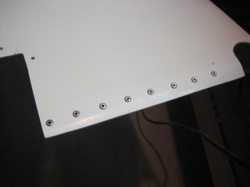 Hinge riveted in place.