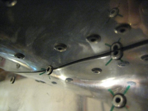 Bottom of horiz stab skin hitting 2 rivets.