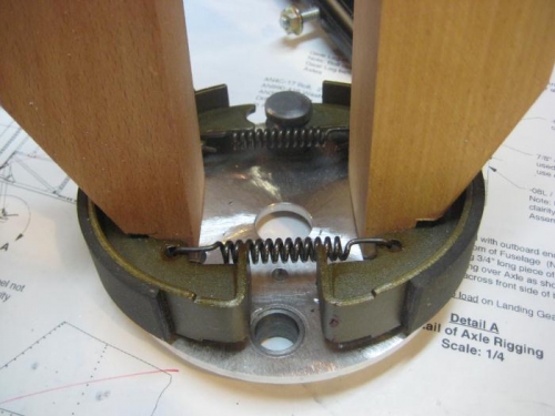 Using wood clamps in reverse, to spread the shoes.