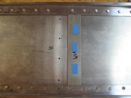 The thick spacer with double-sided tape. Now flip it over and center on holes.