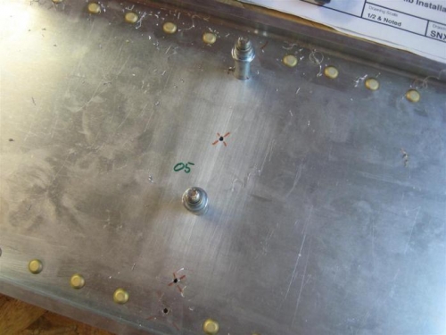 Drilling from opposite face of spar, through spacers.