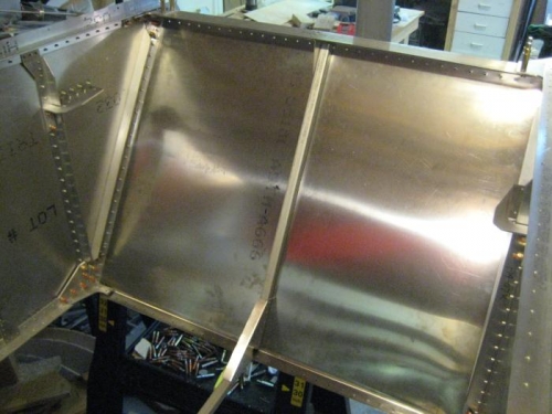 Riveted the stiffener to the firewall, then riveted the firewall to the fuselage sides.