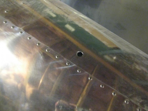 Hole in top of fuselage. It kills me to drill holes in my bird!