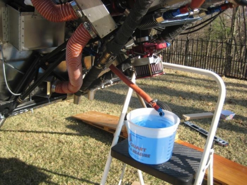 Fuel hose disconnected, and 1 gallon in the bucket.