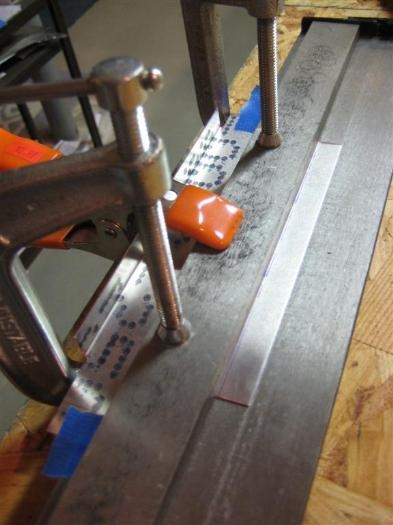 Now the c-clamps are screwed down on top of the bar. Everything stays aligned.