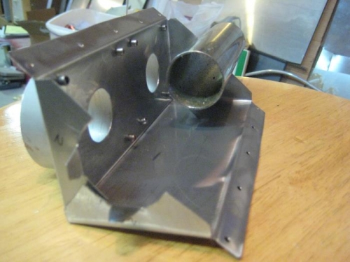 A section of exhaust pipe in one end for reference