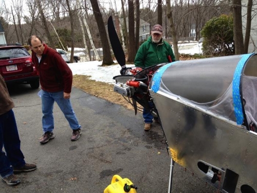 Checking for leaks after oil was added.