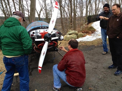 Removing the spark plugs to prime the engine oil.