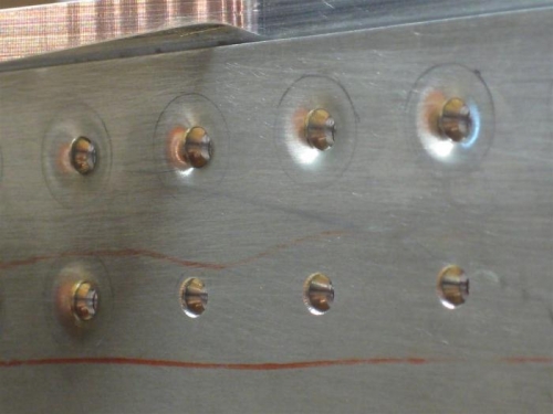 5 dimpled holes; 3 waiting to be dimpled