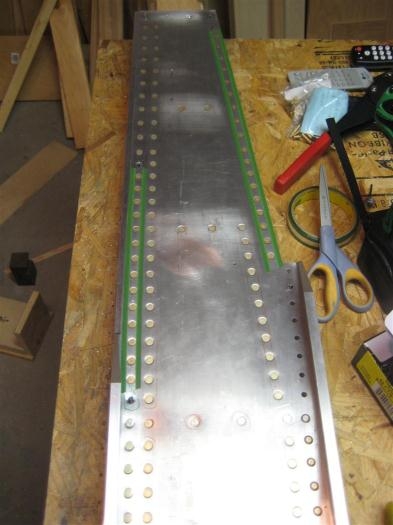 Most flush rivets set; ones under green tape yet to go