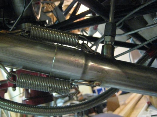 Upper and lower exhausts, with springs, and safety wire.