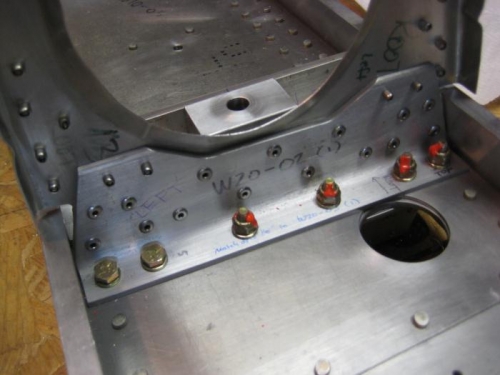 Forward root rib riveted. I had to remove 3 of the bolts to access 3 of the rivets for pulling.