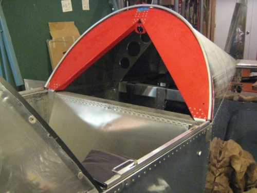 Working the bow into position, attached to the corner brackets.